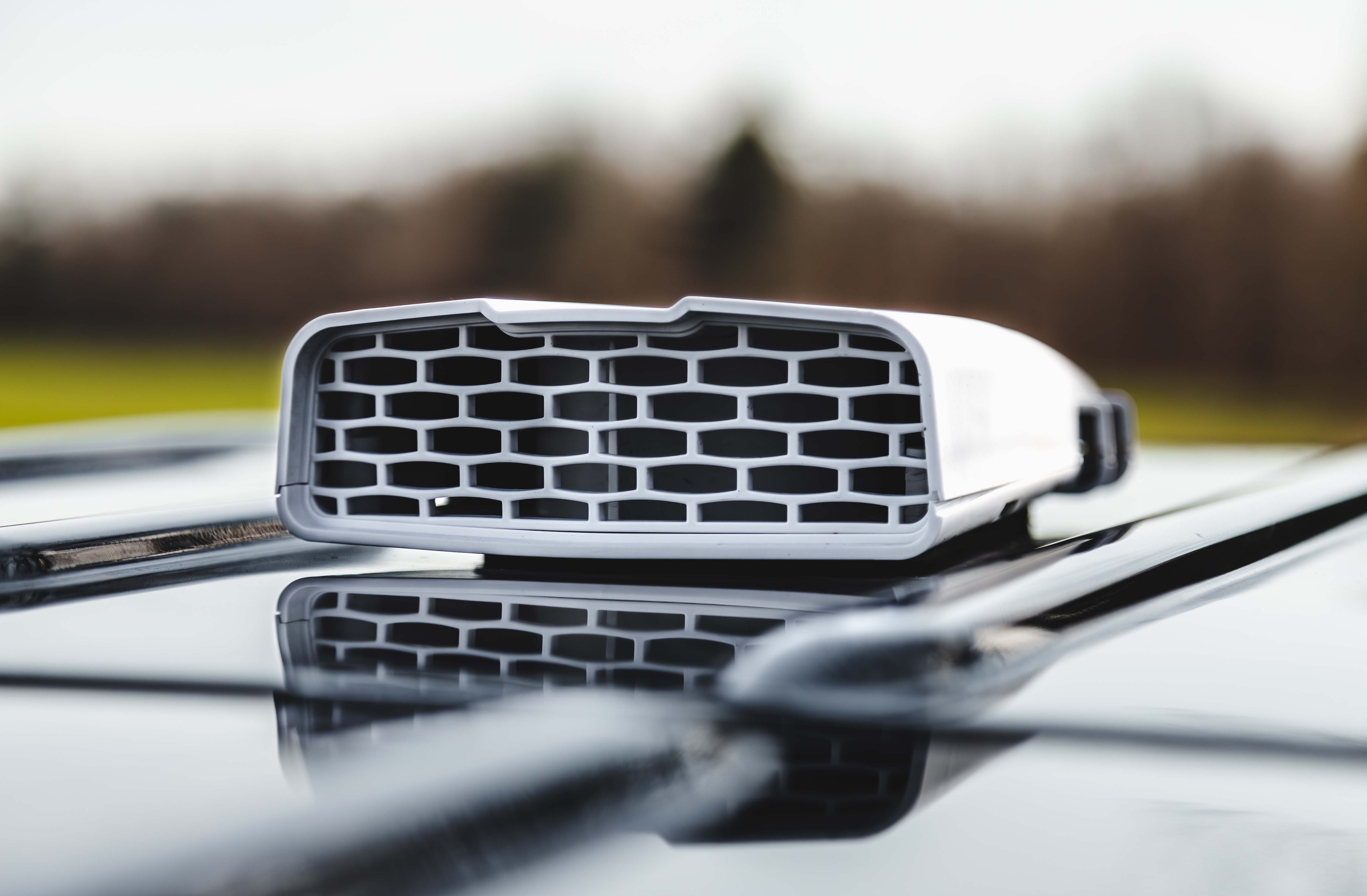 A LEGEND VanFan roof-mounted ventilation unit on a work van, low profile against the roofline.